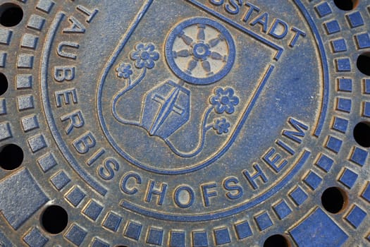 Tauberbischofsheim, Baden-Württemberg / Germany - 13 05 2019: Manhole cover of Tauberbischofsheim with coat of arms