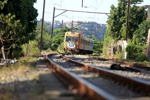 salvador, bahia / brazil - november 23, 2015: suburban train is seen passing through the Lobato neighborhood in the city of Salvador.