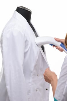 steaming medical clothing on a manicure on a white background