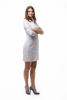 A girl in a medical or cook's robe stands on a white background