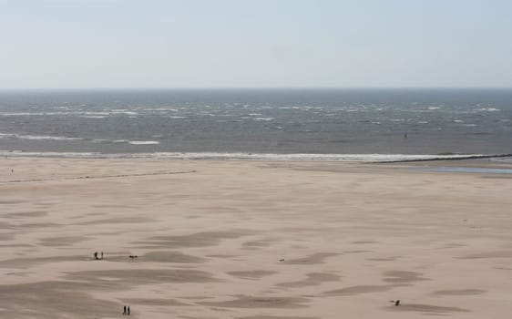 a long lonely sand beach, on the North Sea