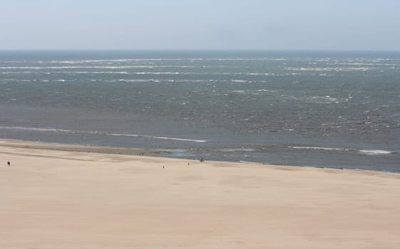 a long lonely sand beach, on the North Sea