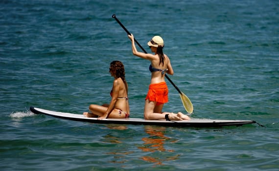 salvador, bahia / brazil - october 25, 2014: people are seen practicing Stand Up on Porto da Barra beach in the city of Salvador.