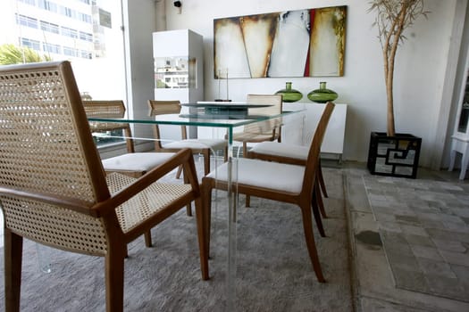 salvador, bahia / brazil - april 1, 2015: Dining room with Mia chair (upholstered) and also with Bend chair is seen in a store in the city of Salvador.