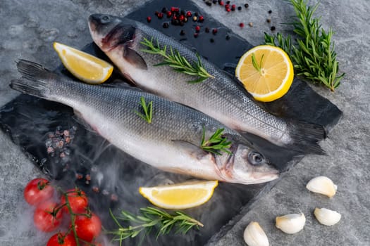 Fresh oyster serve with lemon in basket on black stone plate. Fresh seafood food and european cuisine gourmet concept.