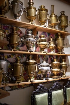 Collection of antique samovars on shelves, Belarus