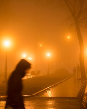 People at a foggy park  in th evening. Kyiv, Ukraine