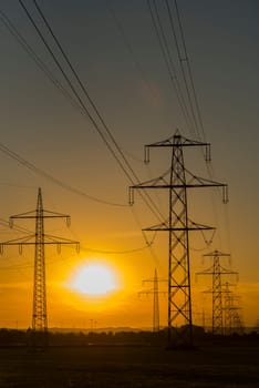 electrical pylons in sunset
