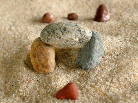 symbolic picture of going through a gate with stones in sand