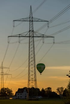 electrical pylons in sunset