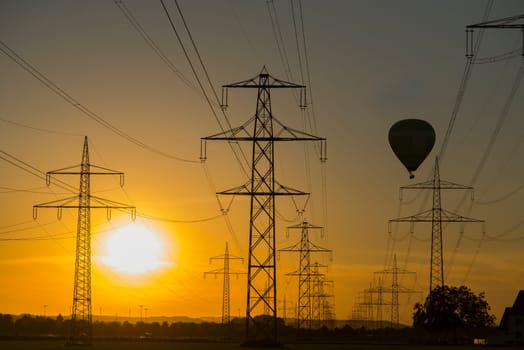 electrical pylons in sunset
