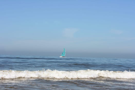 Waves of white foam Crown roll over the sea surface