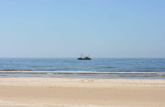 a long lonely sand beach, on the North Sea