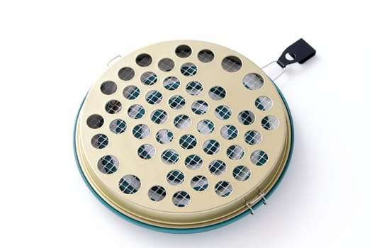 Classic green mosquito coil in a metal plate on white background