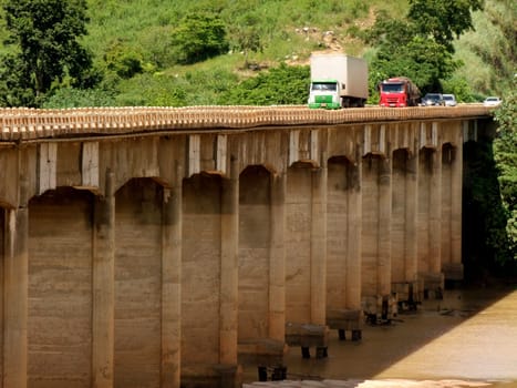 itapebi, bahia / brazil - april 5, 2011: vehicles are seen crossing the bridge over the Jequitinhonha River on the BR 101 road in the city of Itapebi, in southern Bahia.