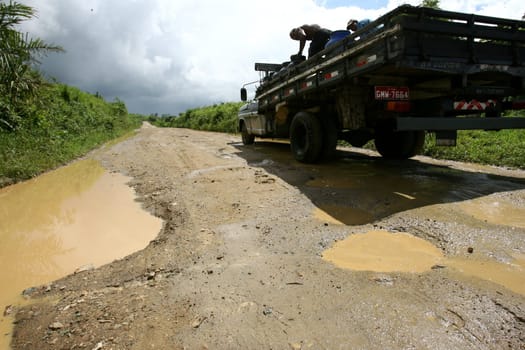 itabuna, bahia / brazil - november 22, 2011: mud and burco are seen on a dirt road leading to the district of Itamaraca, in the municipality of Itabuna, in southern Bahia......