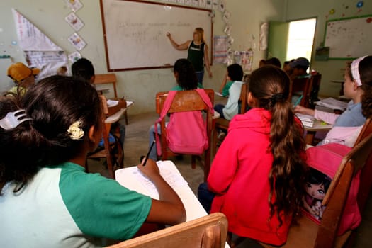 vitoria da conquist, bahia / brazil - october 31, 2011: professors and students are seen in a public school classroom in the city of Vitoria da Conquista.