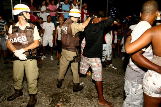 ilheus, bahia / brazil - jeneiro 1, 2012: police officers are seen during an inspection of suspicious people during a party in the city of Ilheus, in the south of bahia.