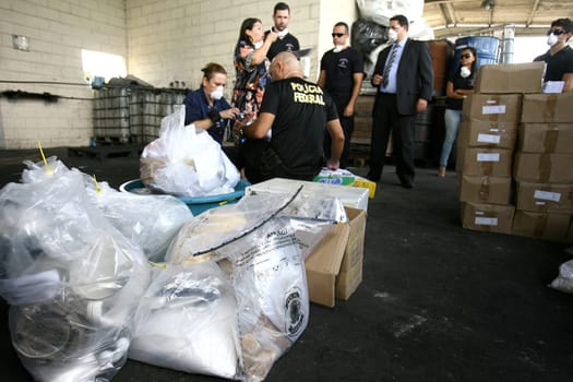 itabuna, bahia / brazil - march 30, 2012: Federal Police agent participates in drug incineration seized in the city of Itabuna, southern Bahia.