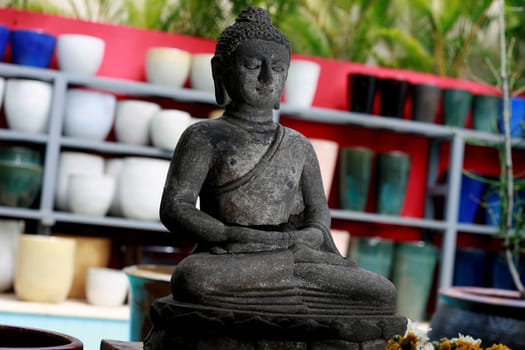 salvador, bahia / brazil - december 26, 2014: Buddha statue made of stone is seen for sale in a store in the city of Salvador.