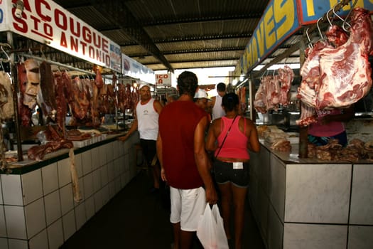 itabuna, bahia / brazil - november 26, 2011: bolvina and pork meat are seen hanging in the stalls, without refrigeration at the Sao Caetano fair in the city of Itabuna..