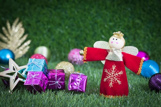 Celebration of New year and Christmas,Close up Christmas decoration on green grass background with copy space