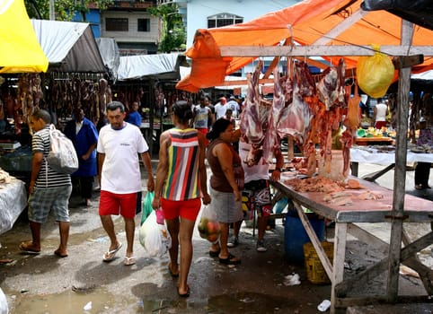 itabuna, bahia / brazil - november 26, 2011: bolvina and pork meat are seen hanging in the stalls, without refrigeration at the Sao Caetano fair in the city of Itabuna..