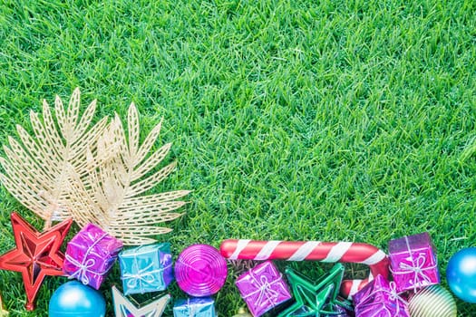 Top view Christmas decoration on green grass background with copy space, Celebration of New year and Christmas