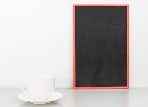 Chalkboard mock up frame and coffee cup on deck in home