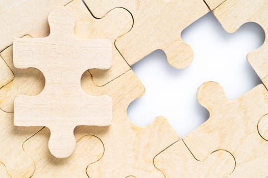 Close up shot of Missing jigsaw puzzle pieces on white background,business concept