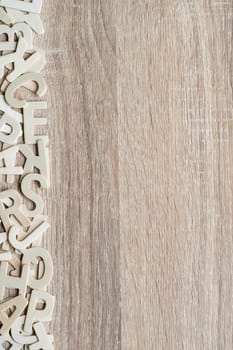 Top view wooden alphabet study english letters,ABC alphabet on wood as a background composition with copy space