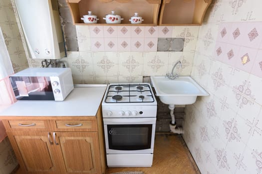 Old kitchen set in the interior of the kitchen in need of repair