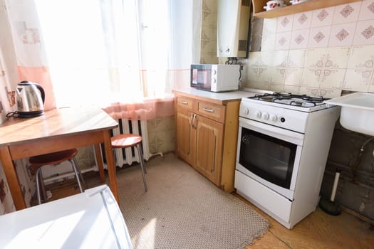 General view of an old kitchen unit in the interior of a kitchen in need of repair