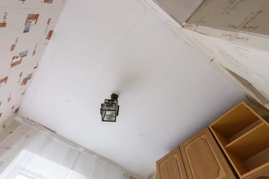Anapa, Russia - June 25, 2020: View of the old ceiling in need of repair in the kitchen