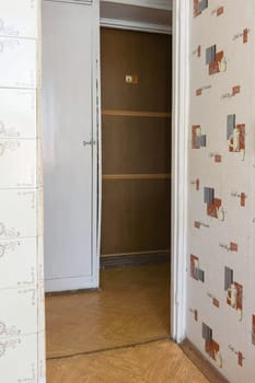 Anapa, Russia - June 25, 2020: Corridor in a small apartment with an outdated interior requiring renovation