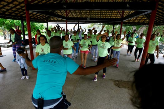 salvador, bahia / brazil - october 4, 2014: people are seen doing aerobics during gym activity at Pituacu Park in the city of Salvador....