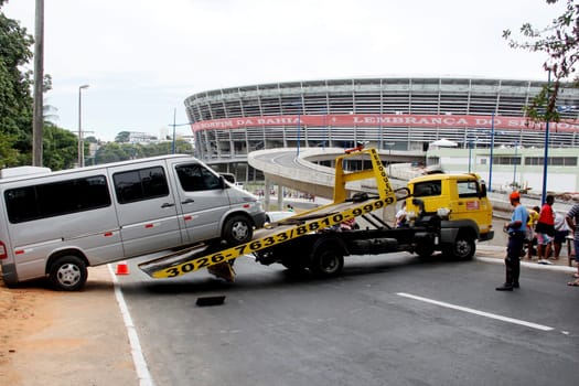 salvador, bahia / brazil - april 7, 2013: winch is seen picking up van parked in a prohibited place in the city of Salvador.