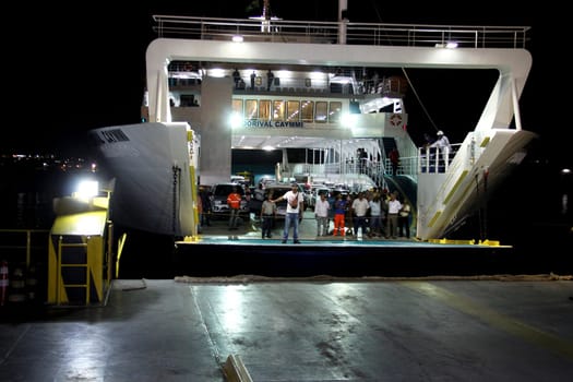 salvador, bahia / brazil - october 1, 2014: passengers disembark from the Dorival Caymmi Ferry Boat, a vessel that crosses the Baía de Todos os Santos from Salvador to Ilha de Itaparica..
