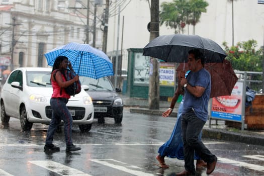 salvador, bahia / brazil - august 26, 2016: People are seen using umbrella during rain in the city of Salvador.