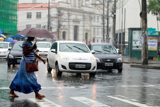 salvador, bahia / brazil - august 26, 2016: People are seen using umbrella during rain in the city of Salvador.