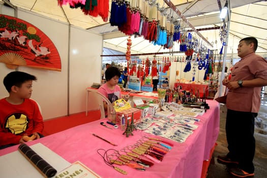 salvador, bahia / brazil - august 27, 2016: people are seen in store stand during japanese culture party at Parque de Exposicoes in the city of Salvador.