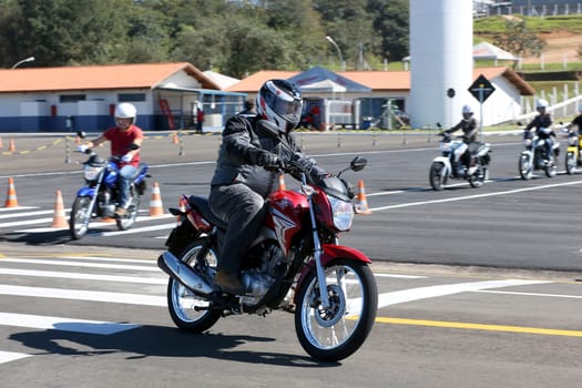 campinas, sao paulo / brazil - july 31, 2013: motorcyclists are seen during test drive with Honda model CG motorcycles in the city of Campinas.