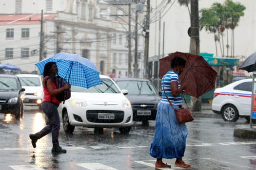 salvador, bahia / brazil - august 26, 2016: People are seen using umbrella during rain in the city of Salvador.