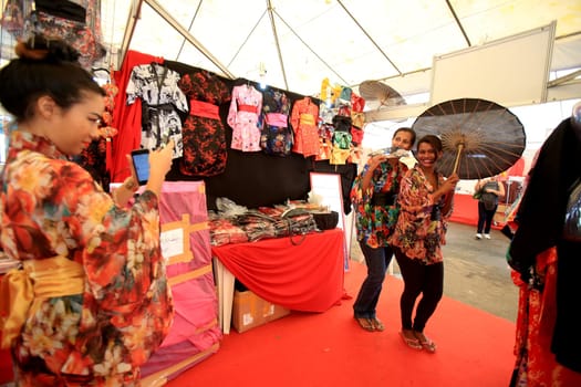 salvador, bahia / brazil - august 27, 2016: people are seen in store stand during japanese culture party at Parque de Exposicoes in the city of Salvador.