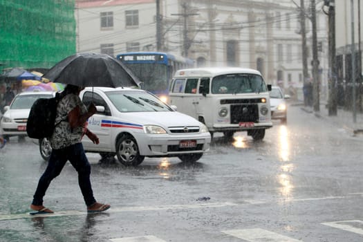 salvador, bahia / brazil - august 26, 2016: People are seen using umbrella during rain in the city of Salvador.