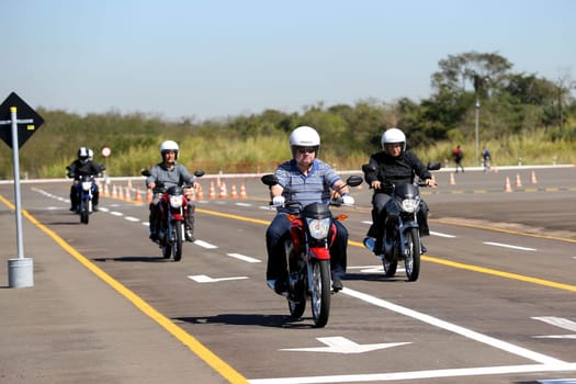 campinas, sao paulo / brazil - july 31, 2013: motorcyclists are seen during test drive with Honda model CG motorcycles in the city of Campinas.