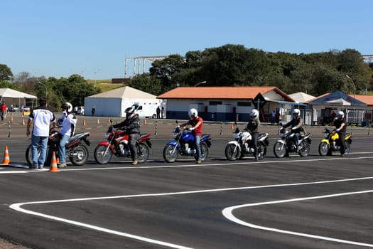 campinas, sao paulo / brazil - july 31, 2013: motorcyclists are seen during test drive with Honda model CG motorcycles in the city of Campinas.