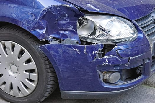 Damaged car front after traffic accident