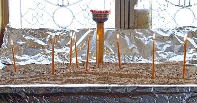 Votive candles in christian church