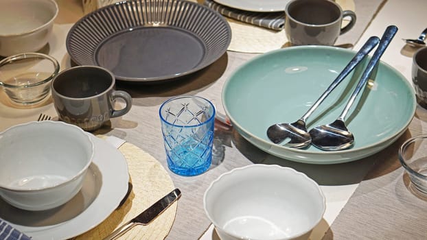 Ceramic dishes and bowls at modern dining table top